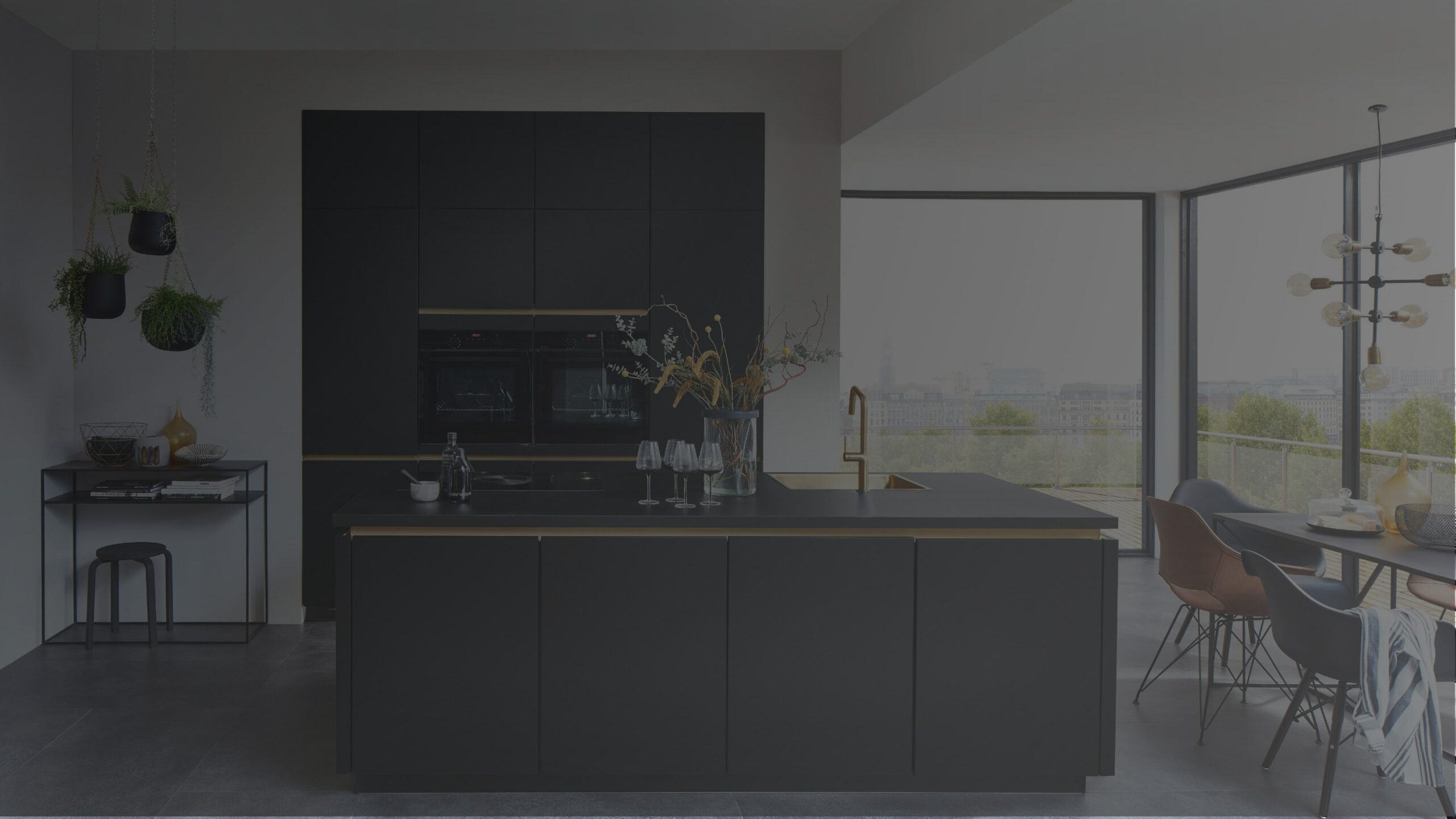 beautifully designed dark themed kitchen